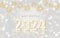 Luxurious decorative Happy New Year illustration with golden openwork Christmas balls hanging on strings and decorated 2024 with