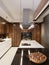 Luxurious designer kitchen with bar, kitchen island and wooden furniture with built-in appliances. Contemporary kitchen