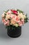 Luxurious and elegant bouquet of roses and Other colors flowers on gray background, copy space.