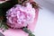 Luxurious flower arrangement with pink hydrangea, eucalyptus,Heather in a pink paper on a white background. Greeting card. Holiday