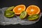 Luxurious fruit background.Orange and kiwi in a cut. Studio photography of various fruits isolated on black background