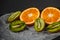 Luxurious fruit background.Orange and kiwi in a cut. Studio photography of various fruits isolated on black background
