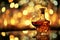 Luxurious glass of cognac alongside beautifully crafted decanter, set against backdrop of festive holiday lights. Warm amber tones