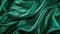 Luxurious green satin fabric texture background