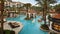 Luxurious hotel pool setting with elegant amenities in sunlit serenity, inviting relaxation