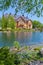 Luxurious house on the shore of a clean lake with birches around. Live in such a continuous gift