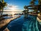 Luxurious infinity pool at a tropical resort, capturing the seamless blend of the pool\\\'s edge with the ocean horizon,.