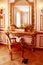 Luxurious interior, boudoir, golden antique mirrors, dressing table