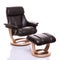 Luxurious leather recliner chair with footstool