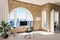 luxurious loft apartment with arched window and panoramic view over urban downtown noble interior computer workspace with desk