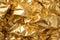 Luxurious and mesmerizing golden crumpled foil texture background for captivating visual design