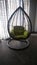 Luxurious metal swing or hammock in the living room of a residential bunglow