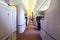 Luxurious and modern empty Interior in the airplane or passenger plane while parking view from rear