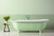 Luxurious modern light green bathroom interior with elegant bathtub and stylish tiled wall design