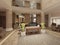 Luxurious multi-storey lobby hall of a five-star hotel, with stone walls and floor. Columns and ceiling light