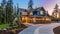 Luxurious new construction home exterior at sunset