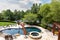 Luxurious outdoor pool in the backyard of a home, overlooking lake