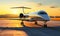 Luxurious private jet aircraft parked on airport runway bathed in the golden hues of sunset symbolizing exclusive travel and
