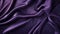 Luxurious purple satin or velvet fabric with smooth waves premium background