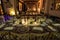 Luxurious romantic party table setting lit by candles, elegant ballroom for wedding reception