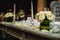 Luxurious romantic party table setting lit by candles, elegant ballroom for wedding reception, decoration ideas