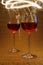 Luxurious shot of rose wine glasses on gold glitter