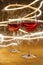 Luxurious shot of rose wine glasses on gold glitter