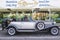 A luxurious silver grey retro Beauford Limousine parked outside a hotel in Albuferia in Portugal