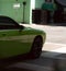 Luxurious smooth green sports car on a road