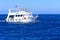 Luxurious snow-white motor yacht in the Red Sea against the blue sky near the unique Ras