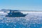 Luxurious snow-white motor yacht in the Red Sea against the blue sky near the unique Ras