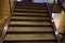 Luxurious staircase with marble steps and decorative and ornamental iron and glass railings. Elegant historical Stairs in a luxury