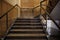 Luxurious staircase with marble steps and decorative and ornamental iron and glass railings. Elegant historical Stairs in a luxury