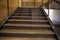 Luxurious staircase with marble steps and decorative and ornamental iron and glass railings. Elegant historical Stairs in a luxury