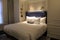 Luxurious suite with king sized bed and deep blue headboard, The Adelphi Hotel, Saratoga Springs, New York, 2018