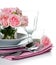 Luxurious table setting with pink roses