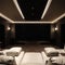 Luxurious theater room with large screen and lighting