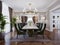 Luxurious trendy dining room interior in art deco style, beige interior with green furniture. Rectangular table with six chairs