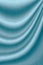 Luxurious wavy blue fabric texture surface curtain wave with a pattern background. macro texture of blue striped fabric