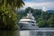 Luxurious White Yacht Cruising Serenely Along Tropical Coastline with Pristine Azure Waters