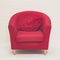 Luxurious wood frame armchair with red fabric seat