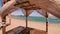 Luxurious Wooden Beach Cabana Braving Strong Winds with Elegant Linen Canopy