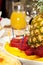 Luxuriously decorated table with pineapple and strawberries closeup