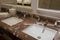 Luxury bathroom with brown beige granite marble stone counter vanity top board, two white ceramic sinks, large rectangular mirrors