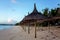 Luxury beach hotel, silhouette of palm trees, swimming pool, an beautiful sunrise