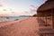 Luxury beach hotel, silhouette of palm trees, swimming pool, an beautiful sunrise