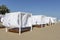 luxury Beach tent on the sea beach with white, fabric, sun protection wooden flooring comfort canopy