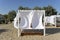 luxury Beach tent on the sea beach with white, fabric, sun protection wooden flooring comfort canopy