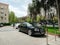 Luxury Bentley black car parked in front of Hyatt hotel