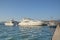 Luxury boats moored on pier on Mediterranean waterfront